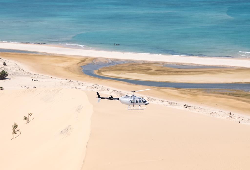 Bell 206 on the red dunes